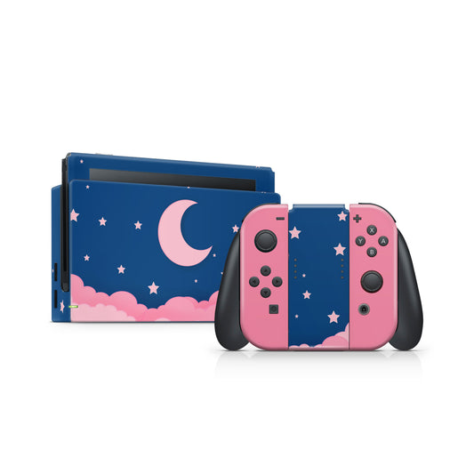 Nintendo Switch console with pink and blue design featuring a moon and stars on a white background